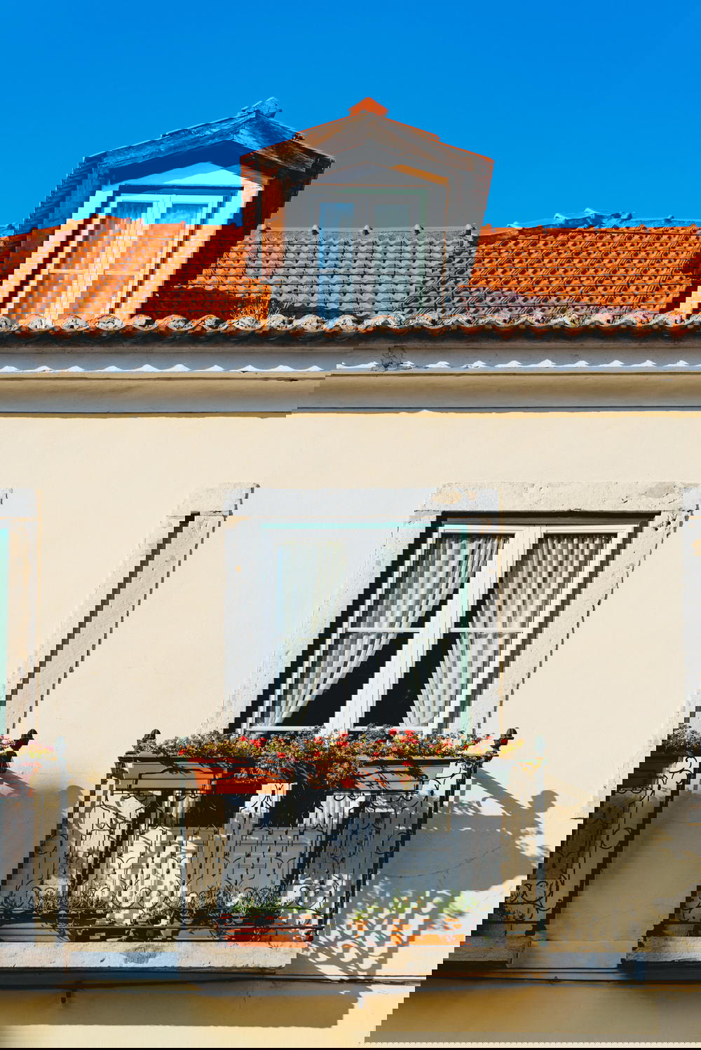 A tan building with a blue sky.