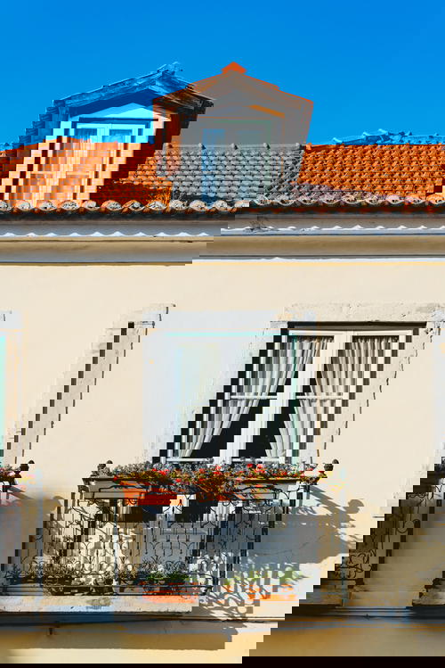 A tan building with a blue sky.