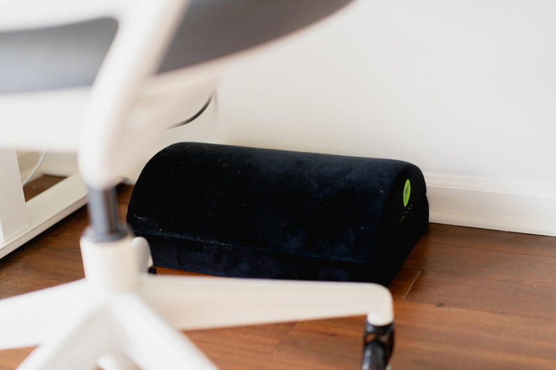 An under the desk black felt foot rest.