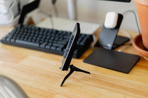 Peak Design mobile tripod with a phone attached.