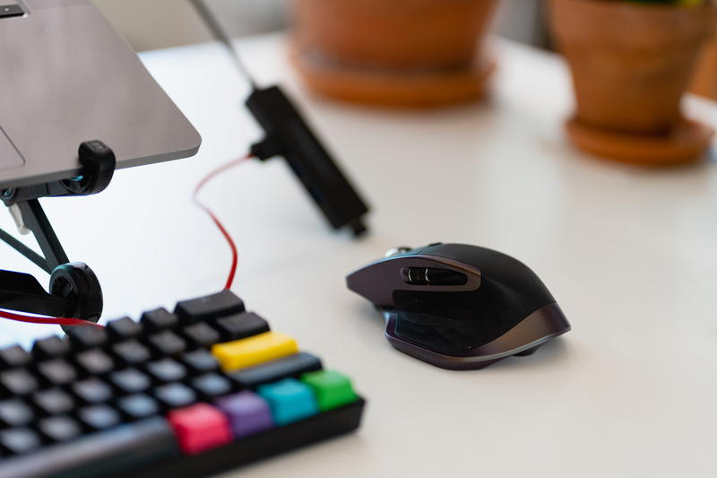 Logitech MX Master mouse on a white desk