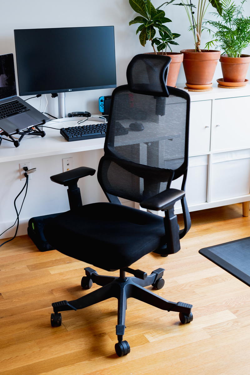 A black office chair in a home office.