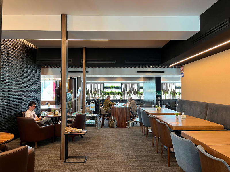 The interior of a restaurant with tables and chairs.