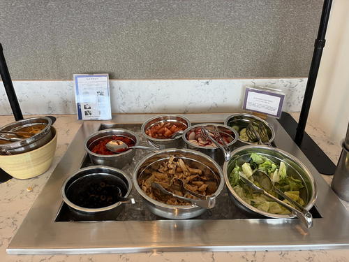 A tray full of different types of food on a table.