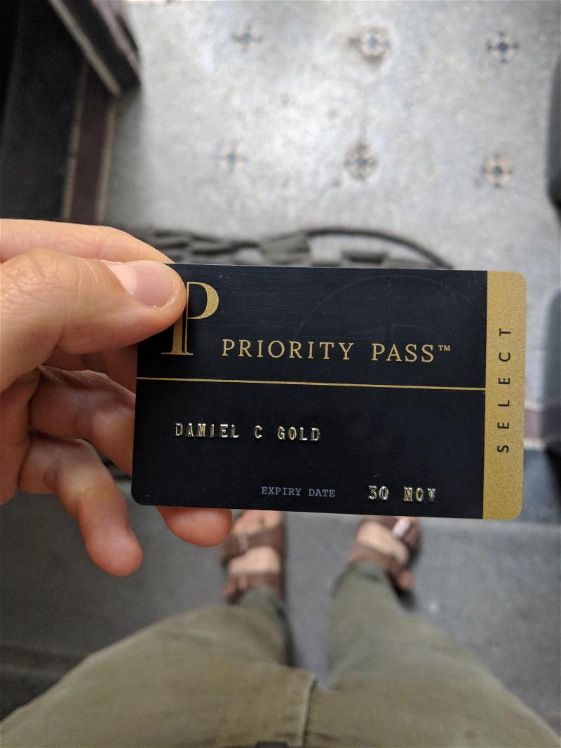 A person with a Priority Pass member card.