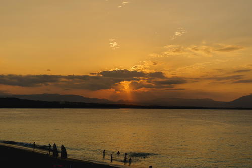 The sun is setting over a body of water.