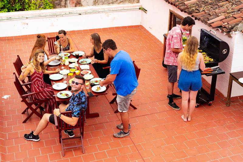 A group of people sitting around a table.