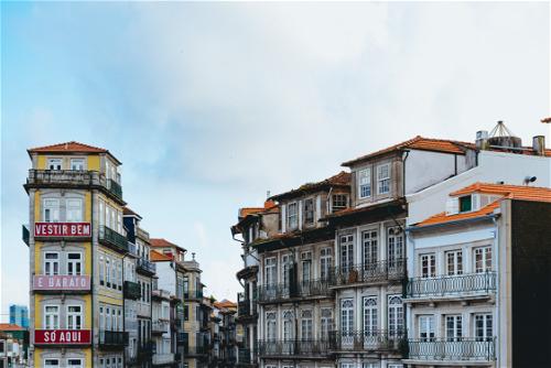 Traditional Portuguese historic buildings in downtown Porto Portugal on a hazy day