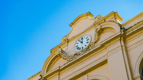 A clock on the side of a building.