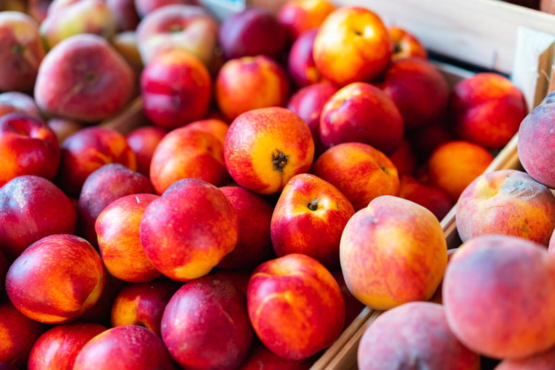 Fresh nectarines at a farmer's market.