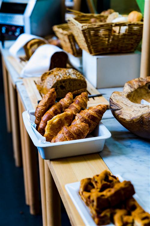 Croissants and fresh breads at a breakfast hotel buffet at the Lloyd Hotel in Amsterdam, Netherlands.