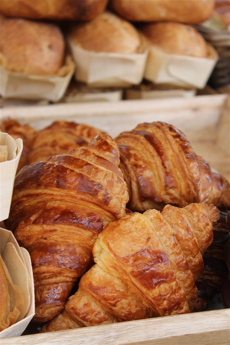 Fresh croissants and baked goods for sale at a cafe in Quebec City.