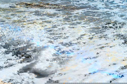Crashing waves and seafoam from the Dead Sea in Israel
