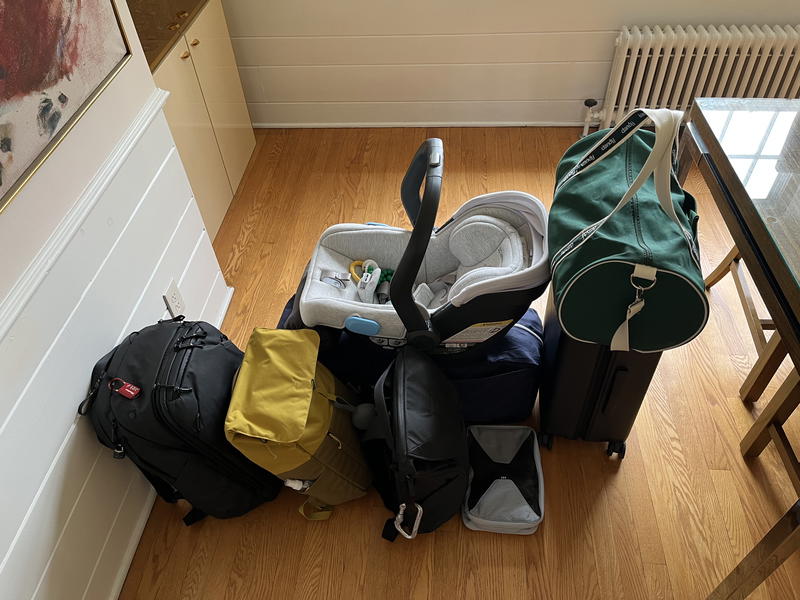 A bunch of luggage on the floor of a room.