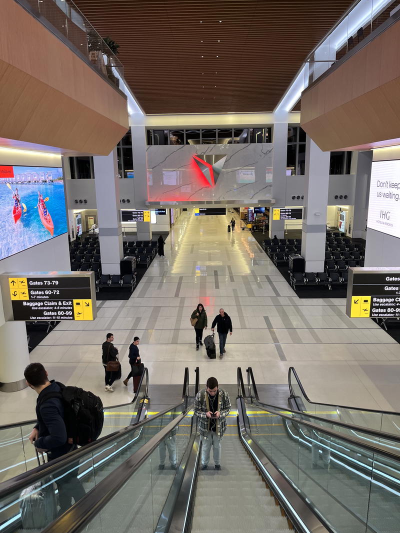 An escalator in an airport.