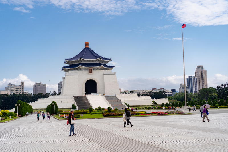 Blue sky and light clouds at a big white famous pagoda with a blue tiled roof in Taipei Taiwan