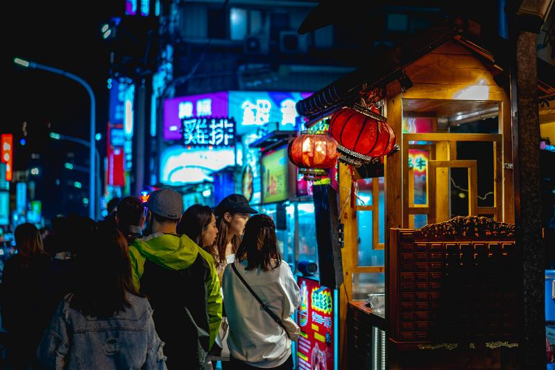 Taiwanese locals visit Raohe night market and street vendor stalls in Taipei, Taiwan