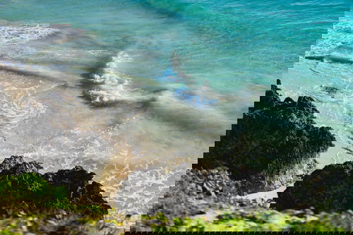 Blue crystal clear waters ocean waves island life paradise in Central America