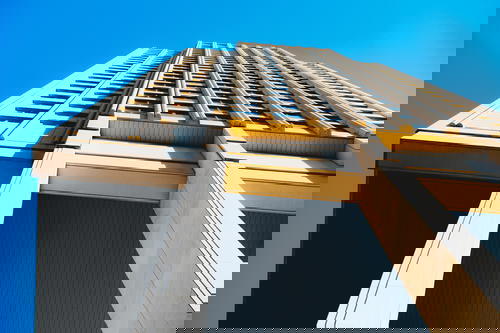 A tall building against a blue sky.