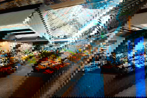 A market with a lot of fruit and vegetables.