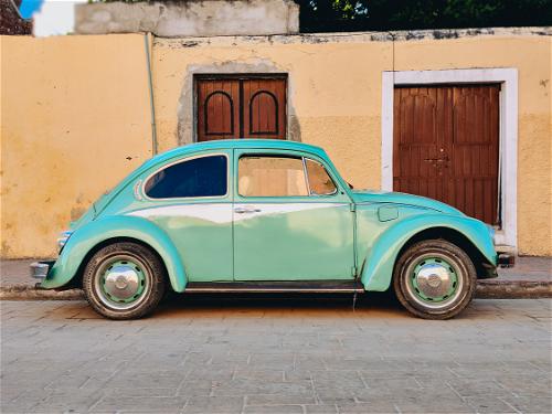 Teal (or light green) 1970s style Volkswagen Beetle