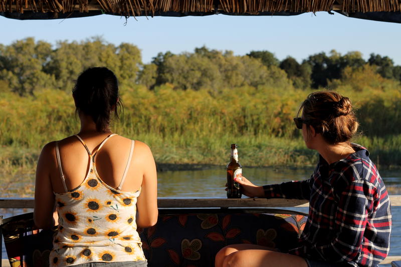 Two women sitting on a boat.