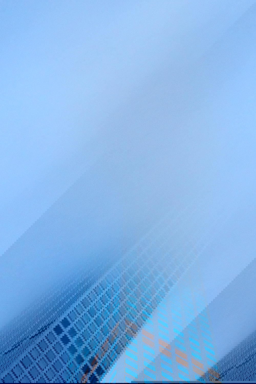 Tall building covered in fog in New York City