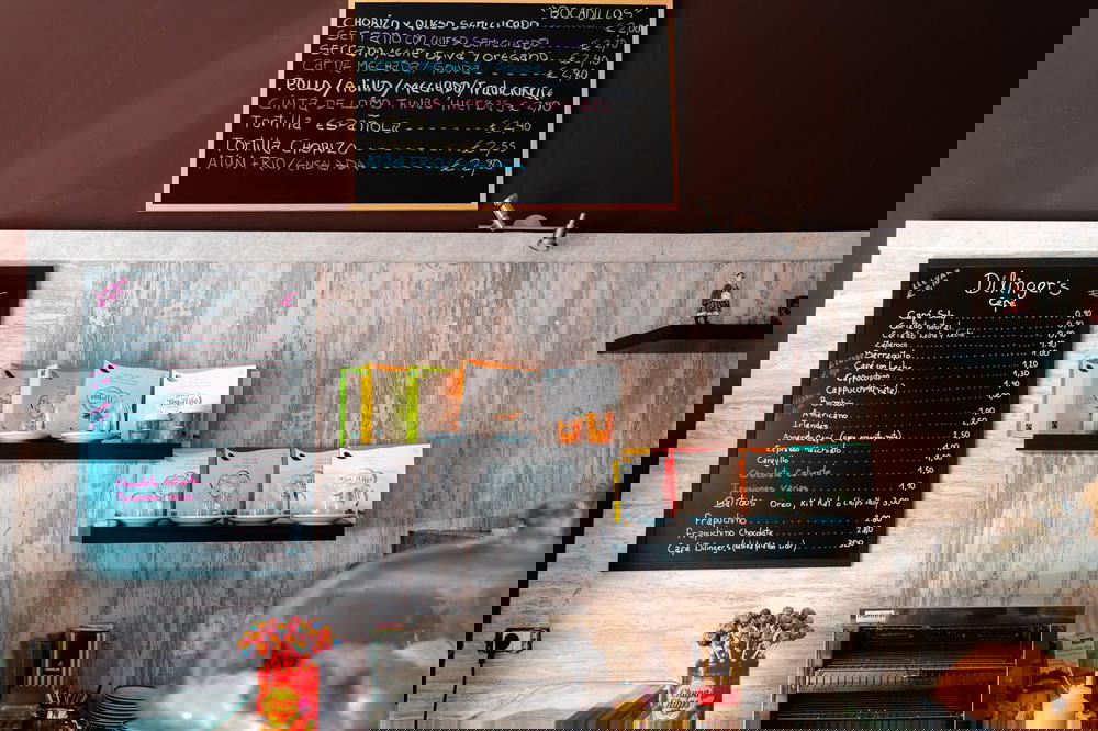 Handwritten Spanish cafe menu on a wall