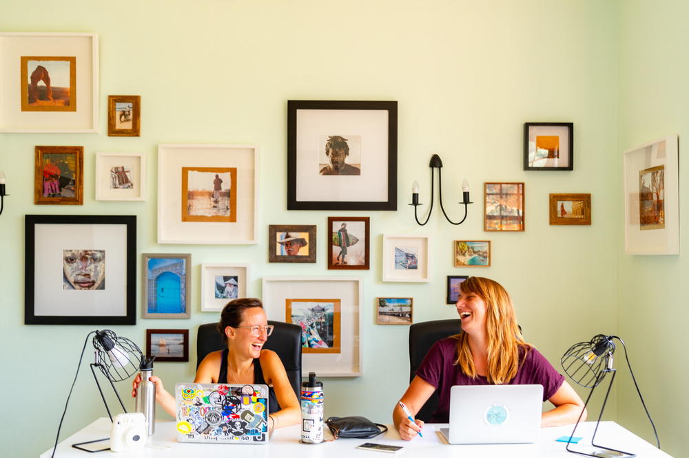 Two women sitting at a desk in Tenerife, Spain.