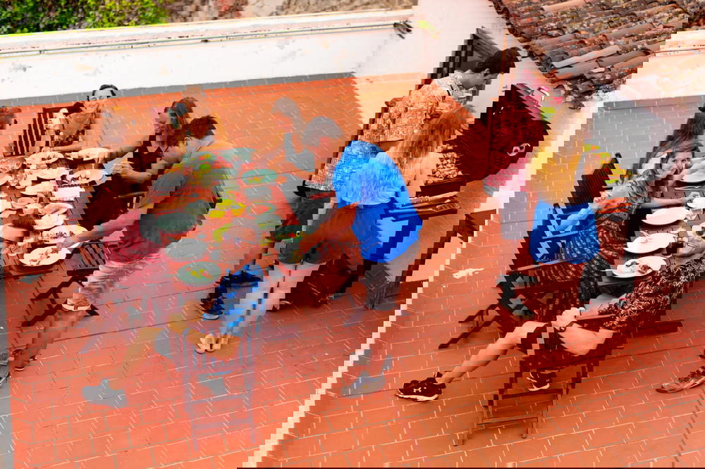 A group of people sitting around a table at Nine Coliving in Tenerife, Spain.
