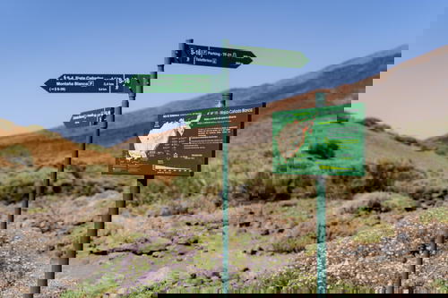 Green national park signs and map route in El Teide National Park in Tenerife, the Canary Islands, Spain