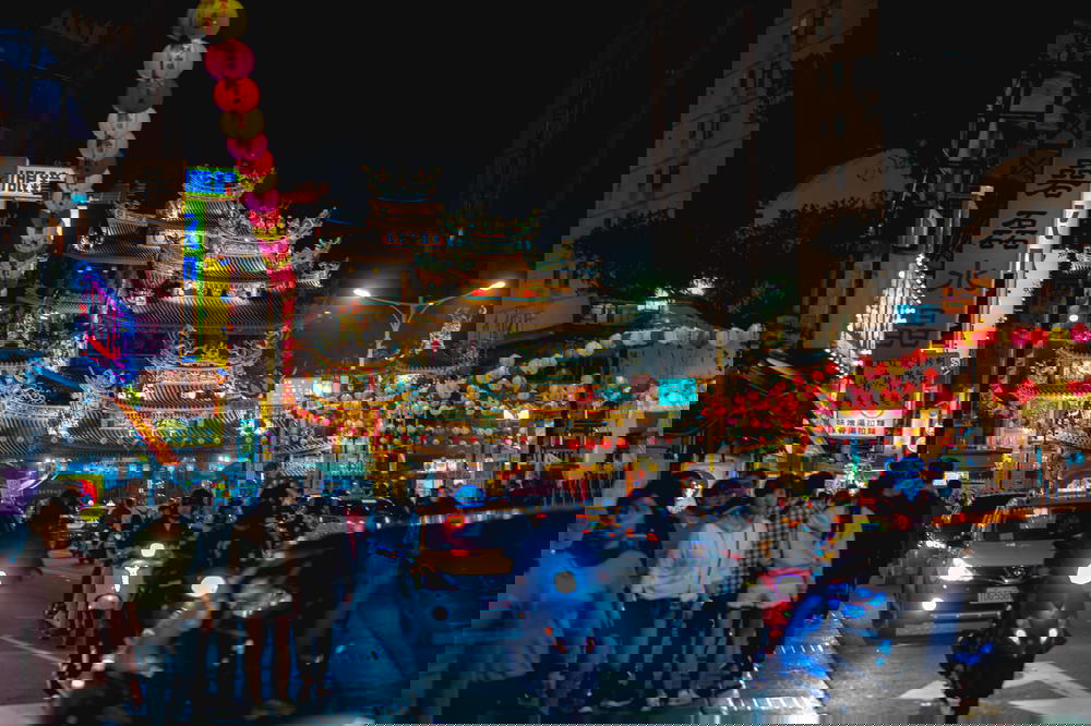 Walking on the street at nighttime in Taipei near You Ci Temple