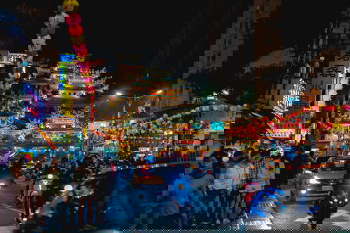 Walking on the street at nighttime in Taipei near You Ci Temple