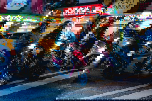 A group of people on motorcycles in Taipei, Taiwan.