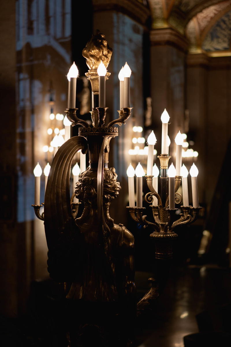 An ornate chandelier in a dark room.