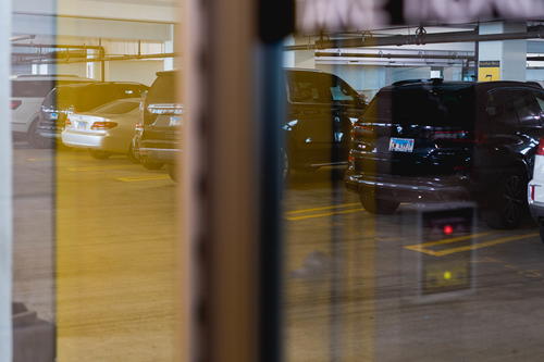 A group of cars parked in a parking garage in Chicago.