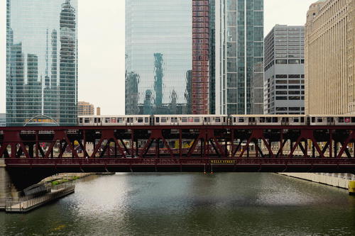 A train traveling over a bridge in Chicago.