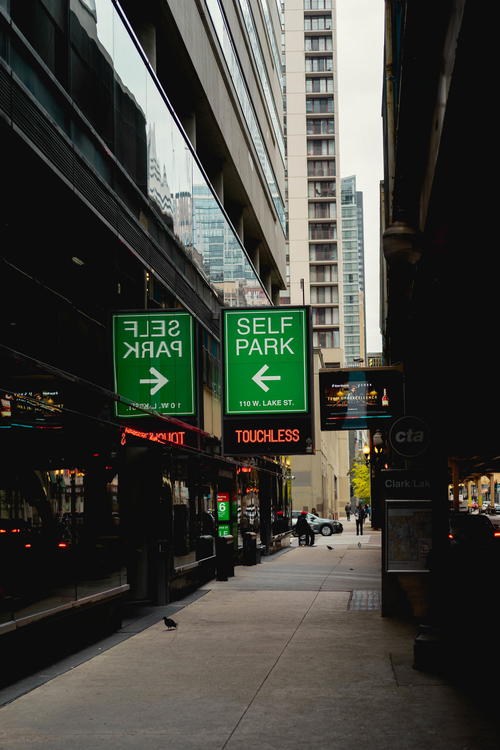 A Chicago street with a self park sign.