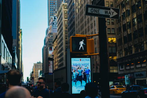 A street sign in NYC's bustling Times Square.