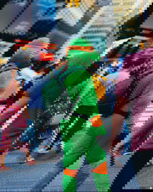 A man dressed as a teenage mutant ninja turtle in NYC's Times Square.