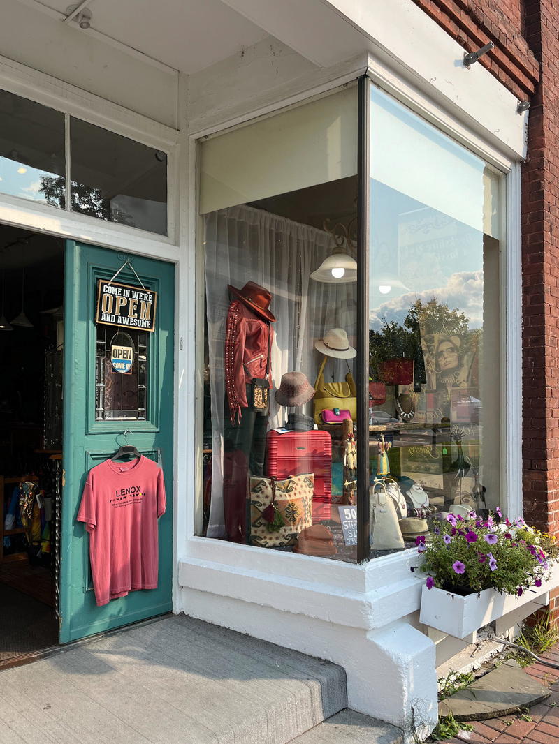 A Massachusetts store front in Lenox with a blue door.