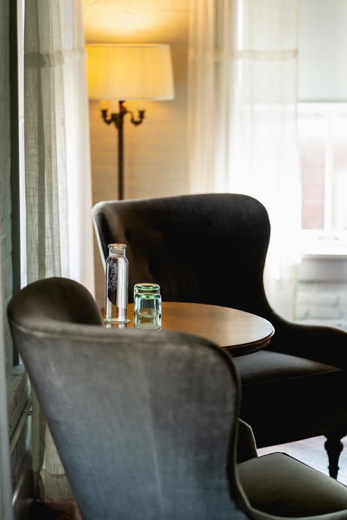 A room in Pittsfield, Massachusetts furnished with two chairs and a table.