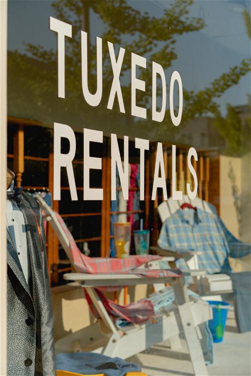 A sign advertising tuxedo rentals in Pittsfield, Massachusetts.