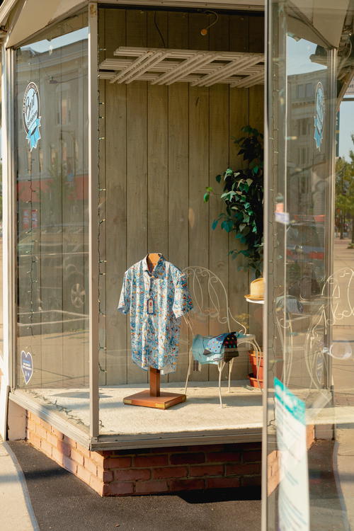 A mannequin displaying a shirt in a store window located in Pittsfield, Massachusetts.