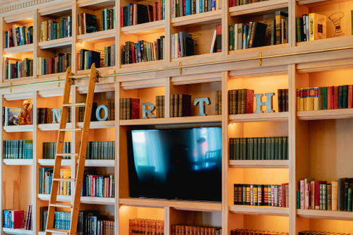 A room with bookshelves and a tv in Pittsfield, Massachusetts.