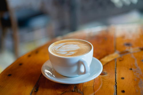 A cup of coffee on a wooden table in Pittsfield, Massachusetts.