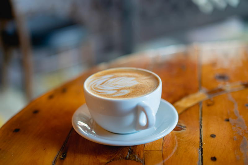 A cup of coffee on a wooden table in Pittsfield, Massachusetts.