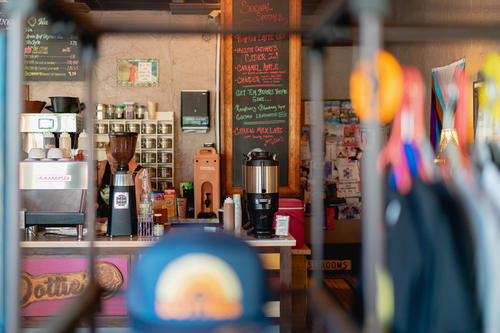 A woman sitting at a counter in a coffee shop in Pittsfield, Massachusetts.