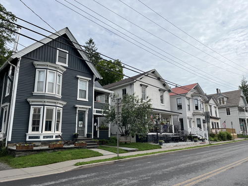 A row of Victorian homes on a New York street.