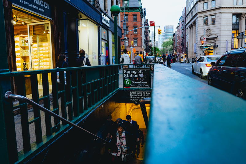 People walking up from the 6 train on Spring street